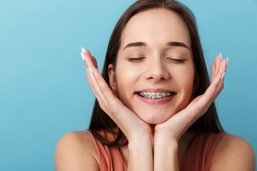 Asian lady showing off her braces in Singapore