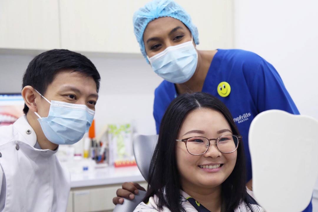 happy-dental-patient-looking-at-smile-after-invisalign-treatment dental xrays on a patient
