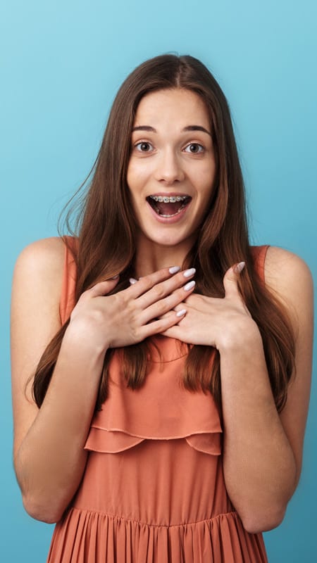 Asian lady proud of her new braces in Singapore