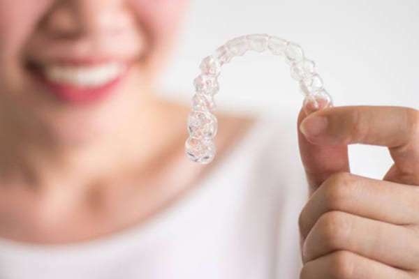 holding on Invisalign clear aligners