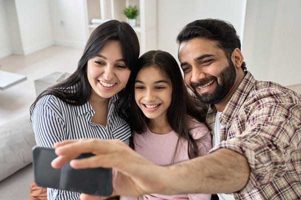 Smiling teens wearing invisalign