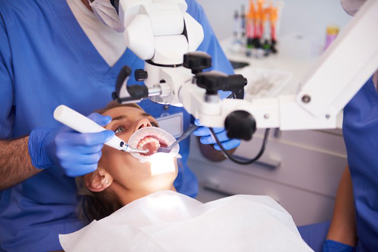 young women getting root canal treatment done