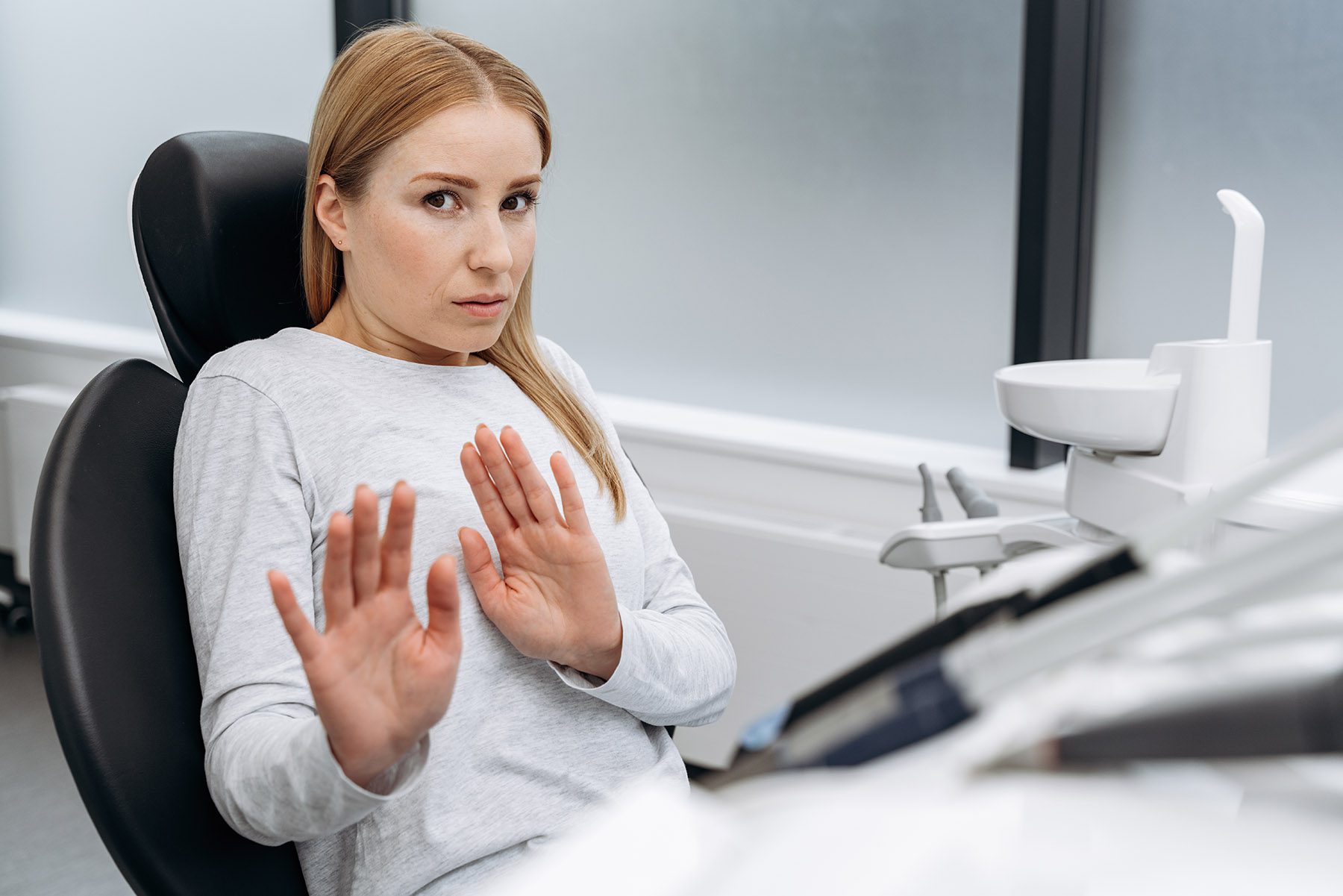 woman afraid to get dental implant woman afraid to get dental implant
