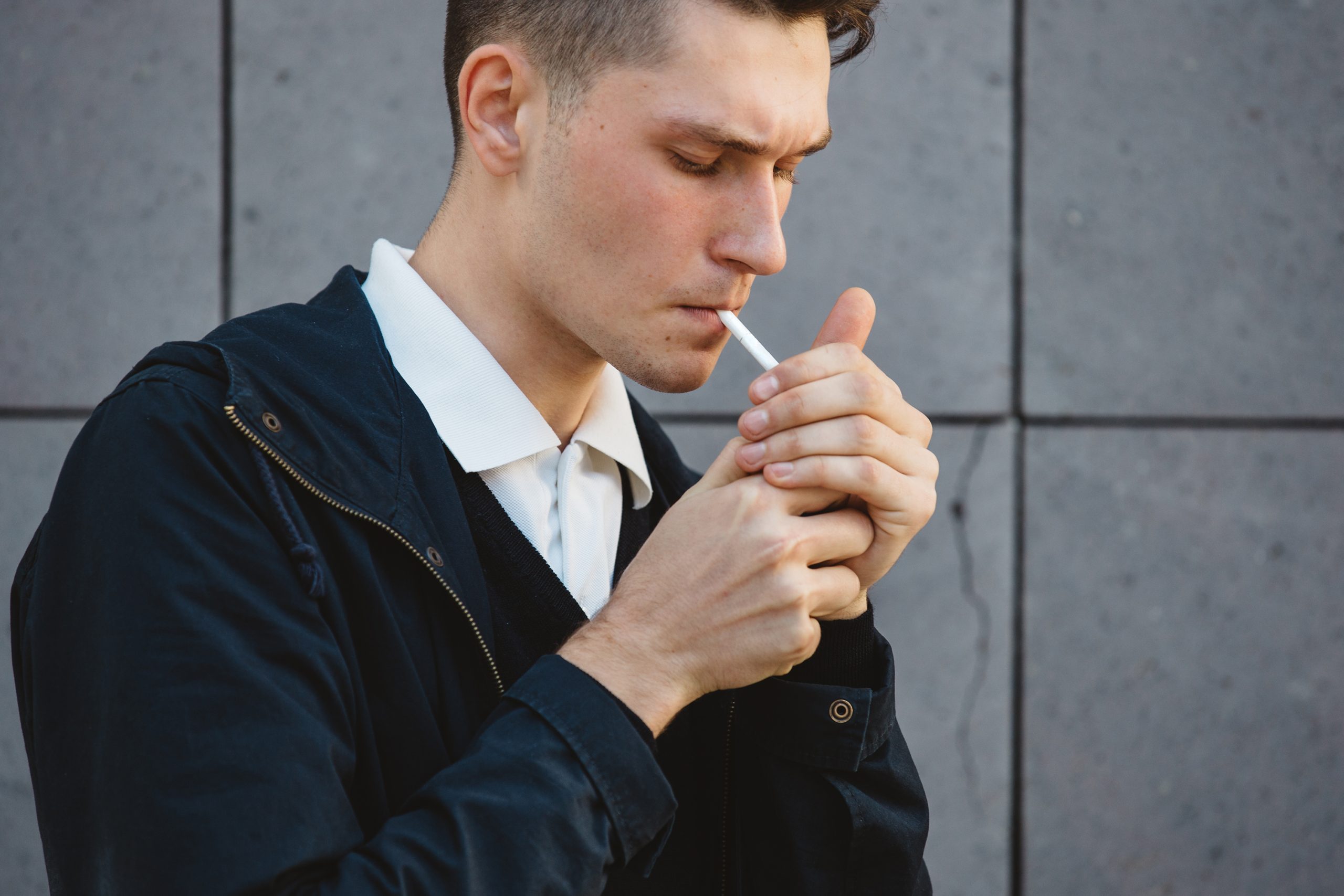 man smoking a cigarette man smoking a cigarette