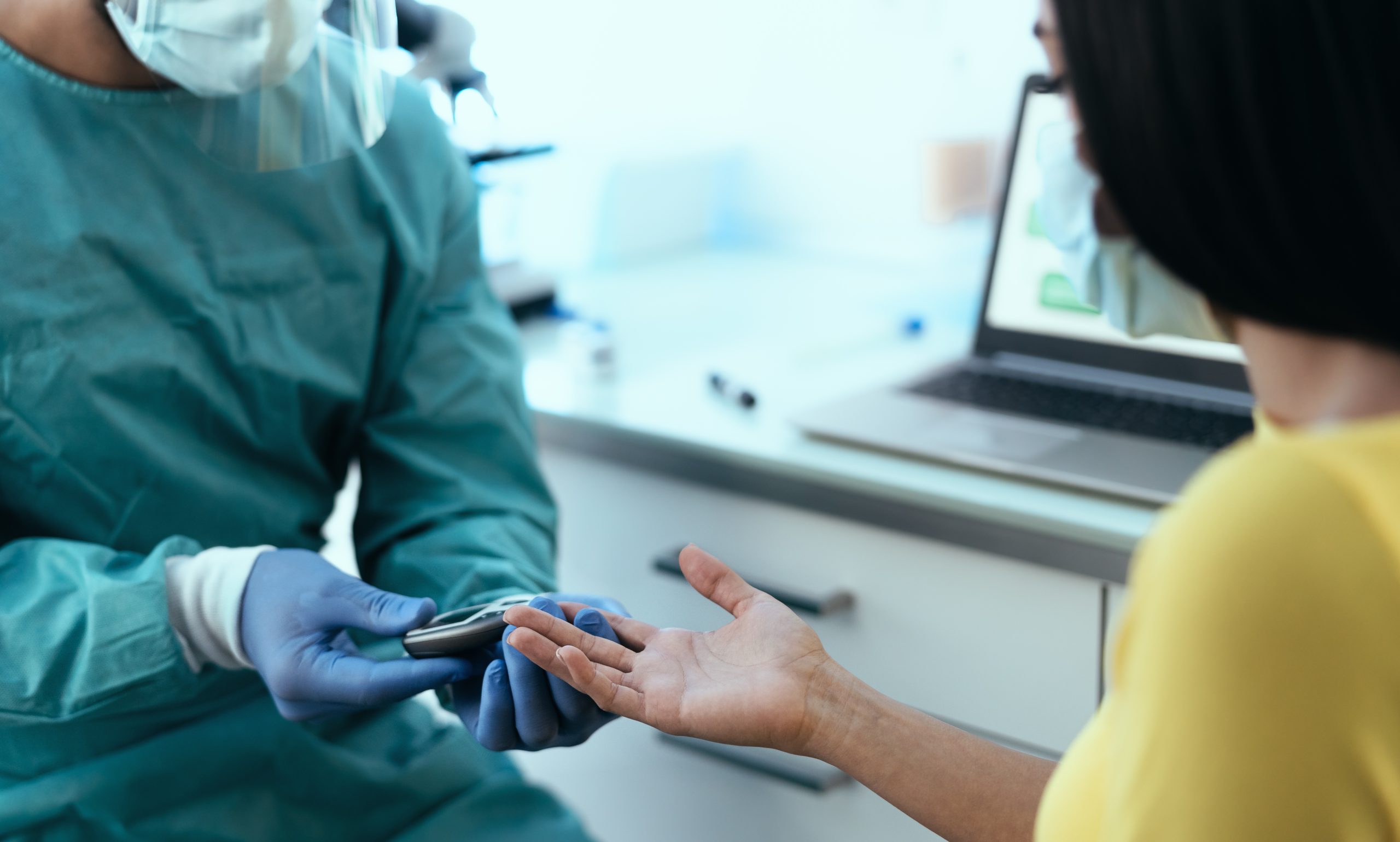 Medical worker checking glycemia test for diabetes to female pat poorly controlled diabetes