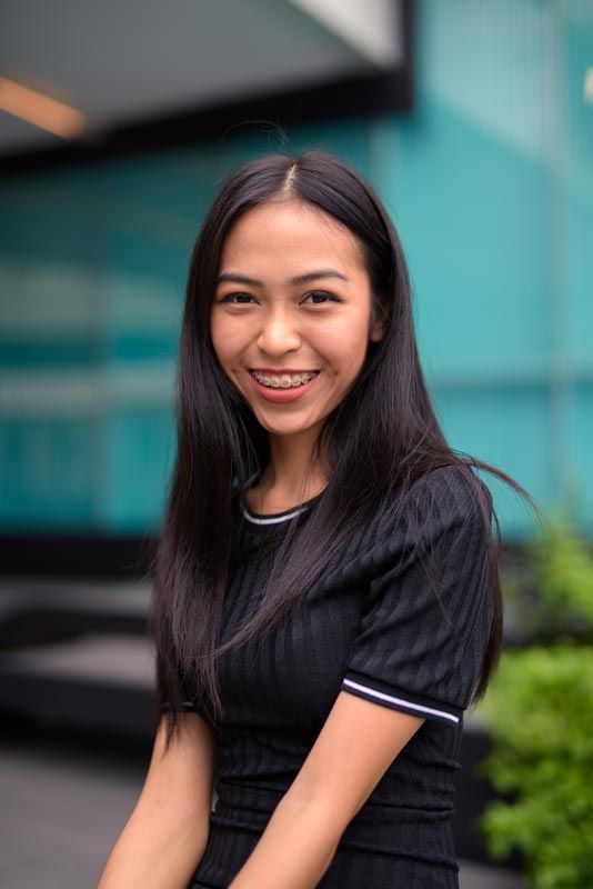 girl in braces smiling women