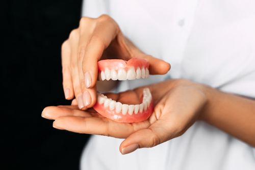 holding dentures