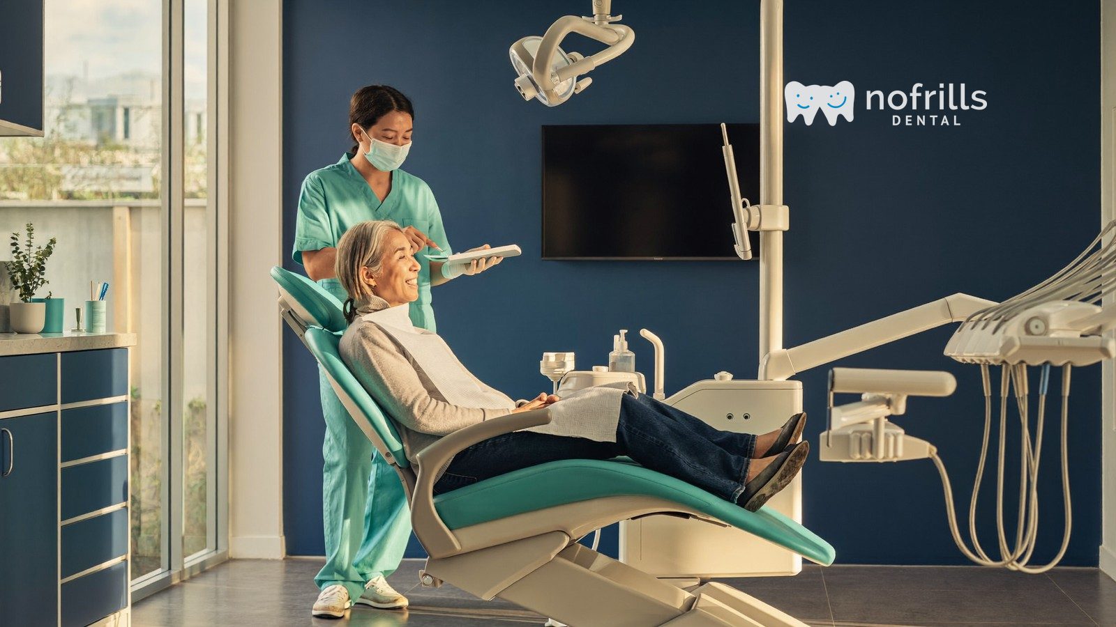 Senior patient discussing CHAS dental subsidies with a dentist at a bright NoFrills Dental clinic in Singapore